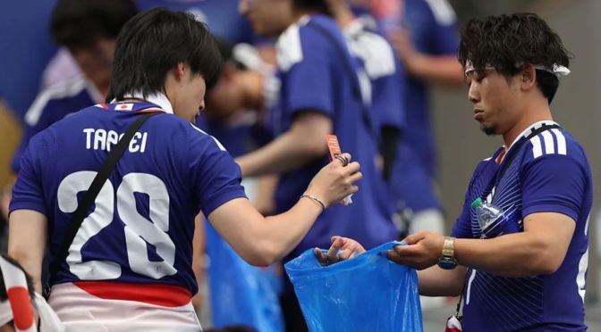 Japanese fans’ stadium cleanups spark debate at home